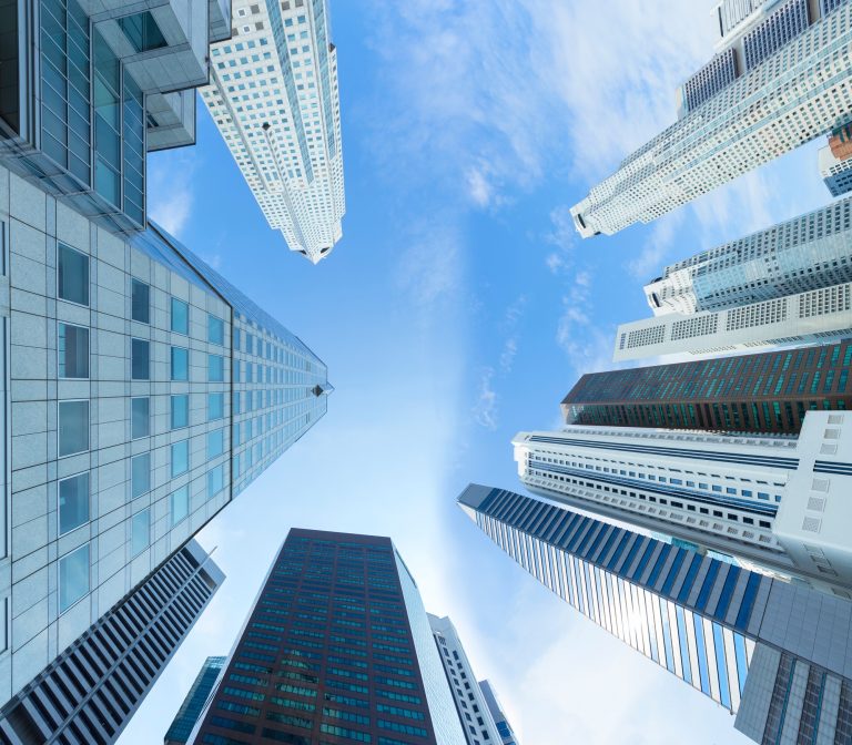 Business buildings view from look up with blue sky and cloud (to represent cloud computing)