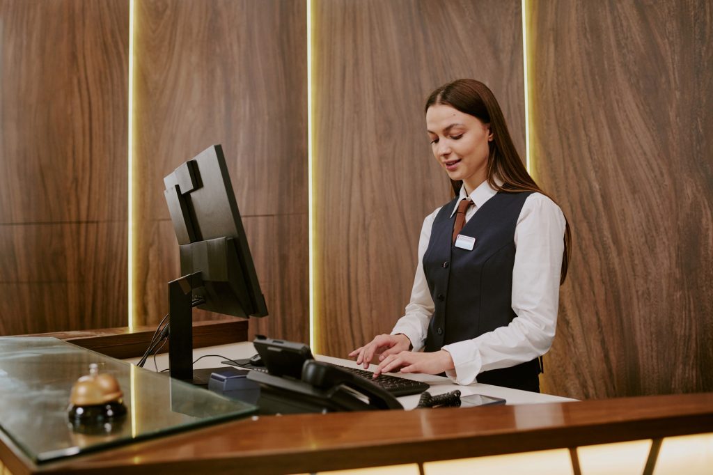 Hotel Worker Typing on Keyboard